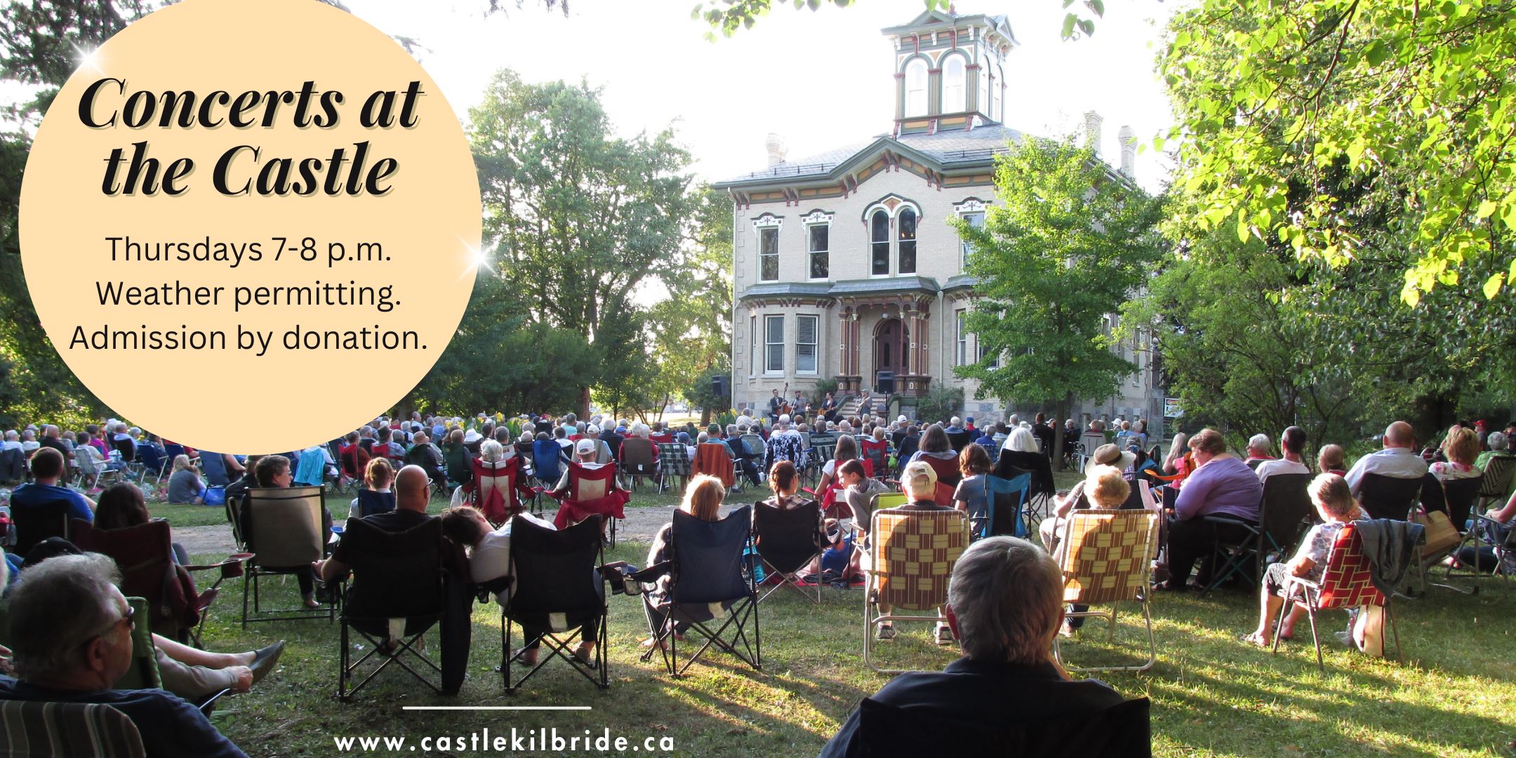 Front lawn of Castle kilbride people in lawn chairs listening to live music