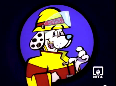 Black background with blue circle. Dalmatian dog dressed in a firefighter's uniform with the name Sparky on the helmet.