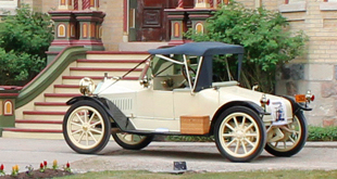 a vintage car in front of Castle Kilbride