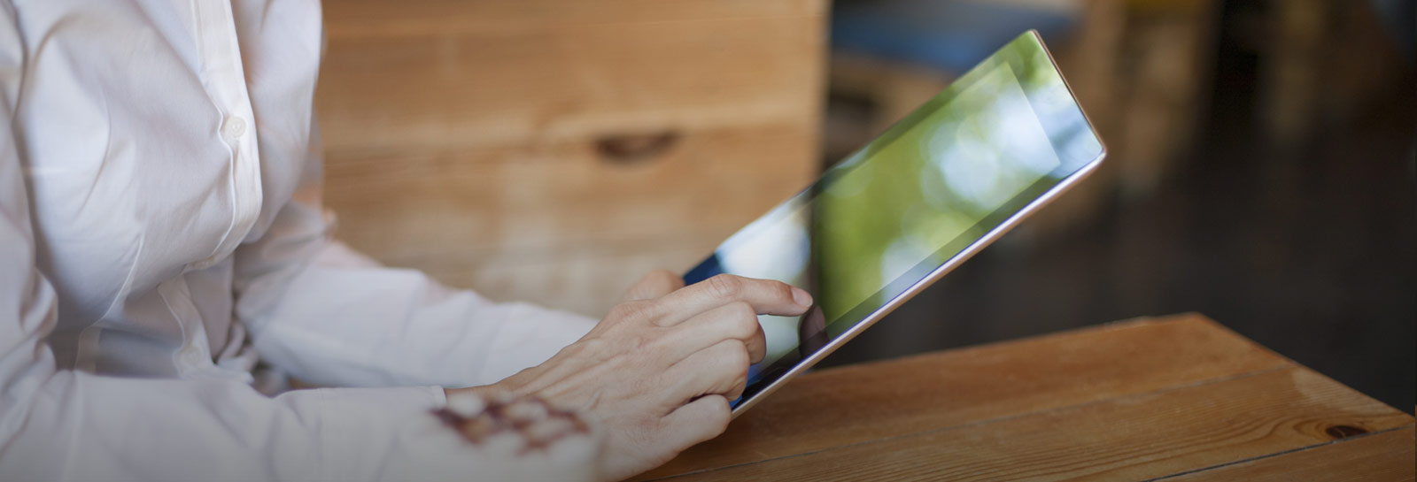 a women holding a tablet